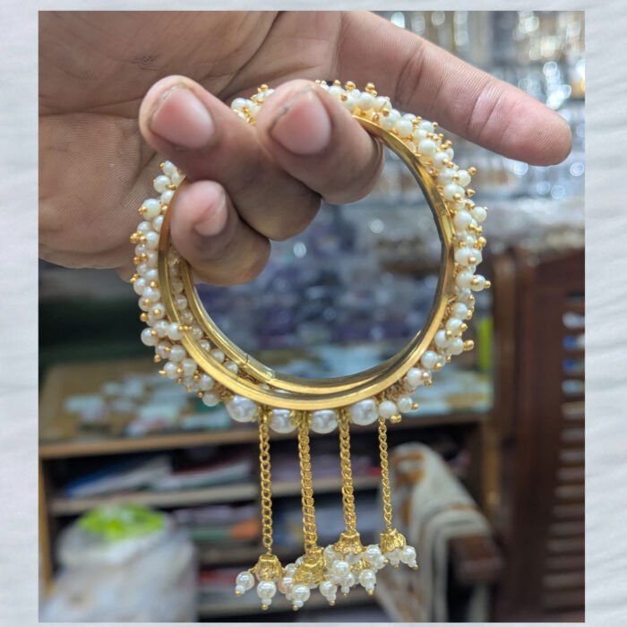 Gold-bangle-with-pearl-tassels