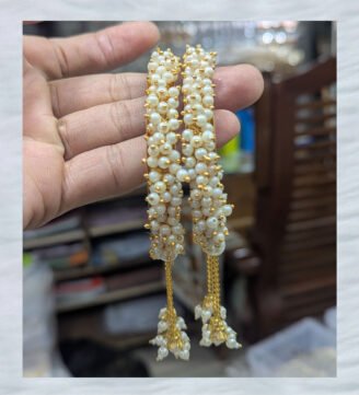 Gold-bangle-with-pearl-tassels